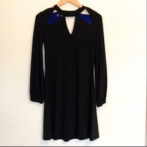 Norma Kamali black long sleeve dress with cutout neckline design.